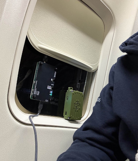 Meshtastic radios in the airplane window